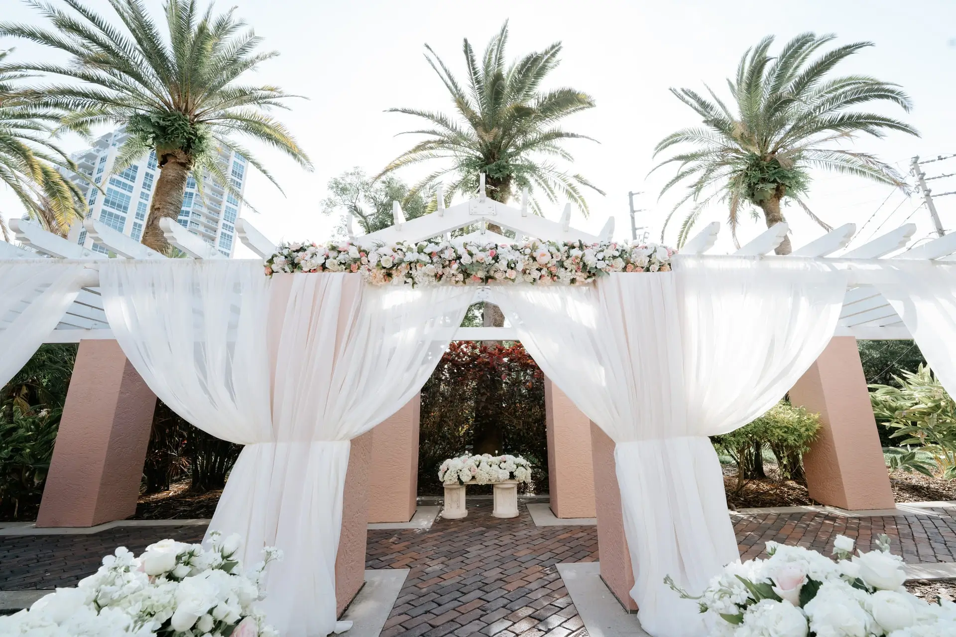 Multicultural ceremony composed under a floral arch