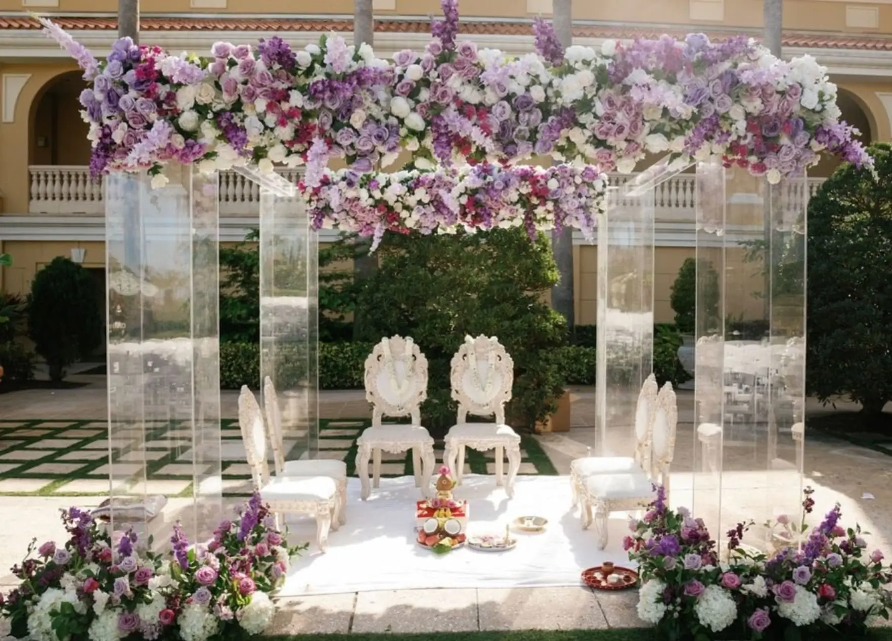 Close-up of ceremony altar styled with brass and petals