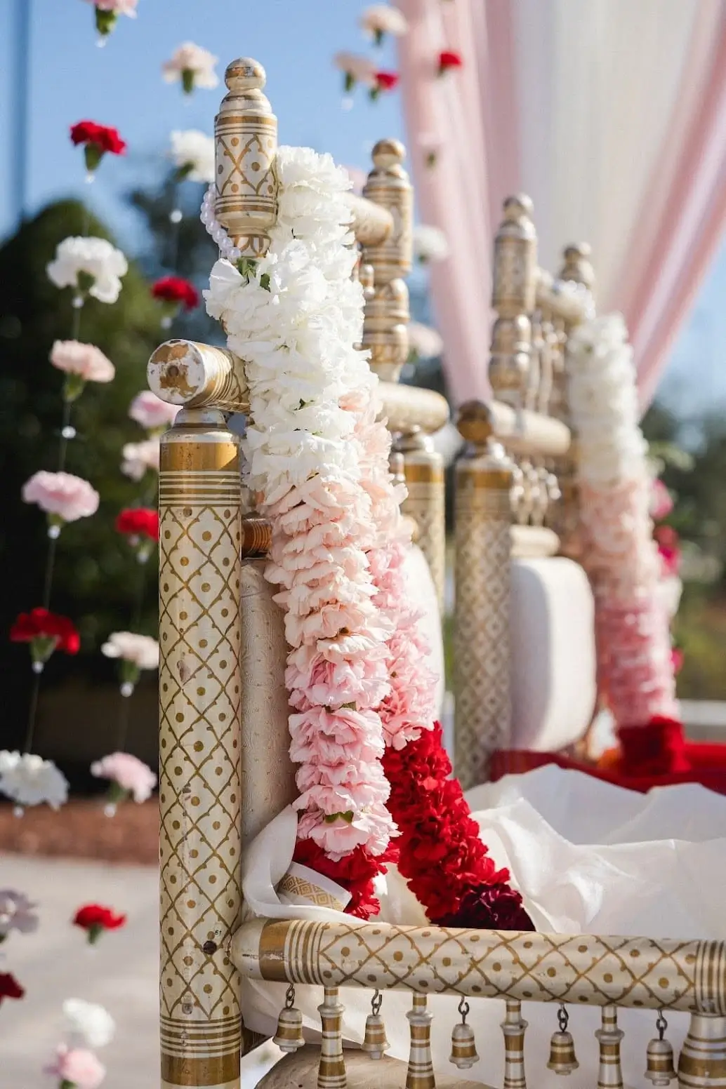 Editorial bride portrait in red lehenga and gold jewelry