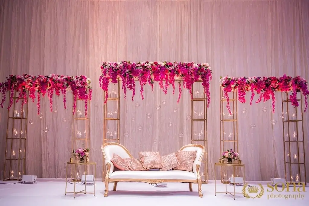 Wide reception decor with chandeliers over a mirrored dance floor