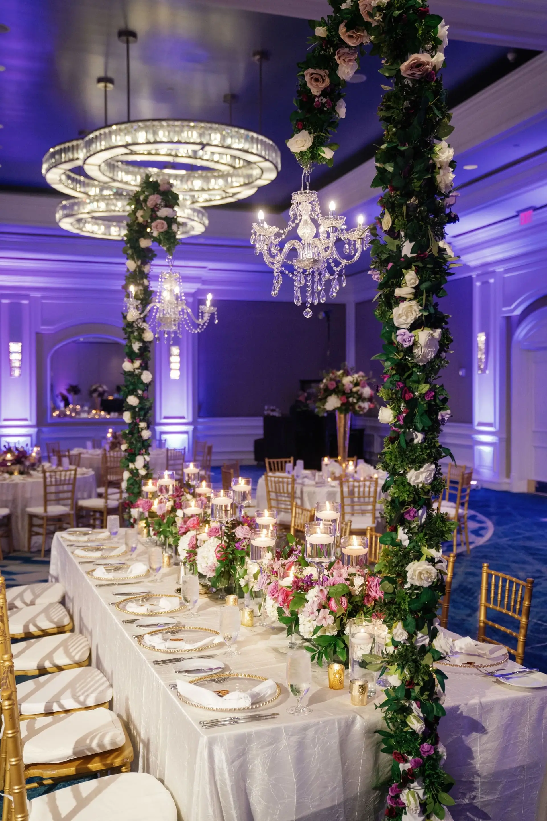 Editorial reception scene with sculptural floral installation